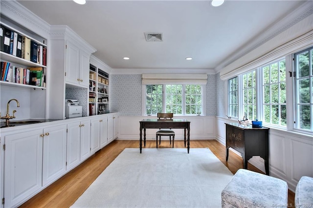 30 Soundview Farm Rd, Weston, CT 06883 - interior space featuring light wood-style flooring, crown molding, wainscoting, recessed lighting, and a decorative wall