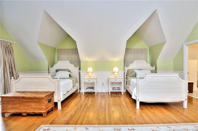30 Soundview Farm Rd, Weston, CT 06883 - bedroom with wood finished floors, vaulted ceiling, and a wainscoted wall