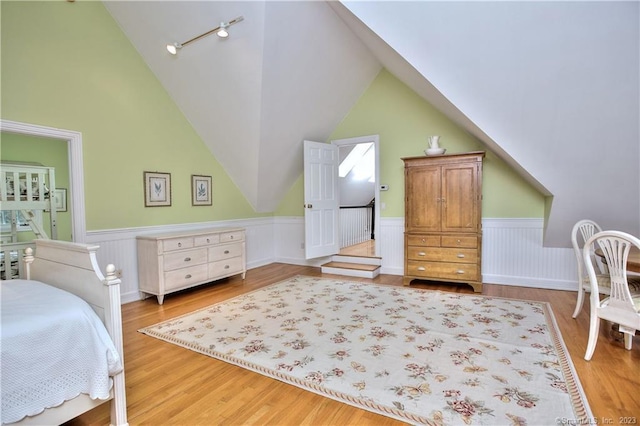 30 Soundview Farm Rd, Weston, CT 06883 - bedroom with wainscoting, light wood-type flooring, and lofted ceiling