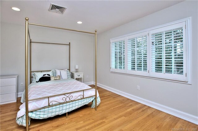 30 Soundview Farm Rd, Weston, CT 06883 - bedroom with multiple windows, light wood-style flooring, and recessed lighting