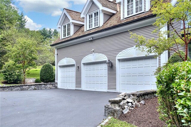 30 Soundview Farm Rd, Weston, CT 06883 - view of property exterior with driveway and an attached garage