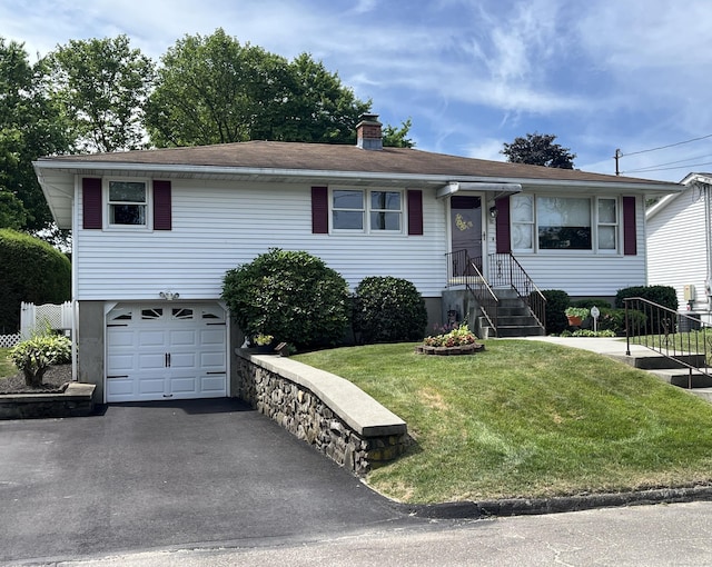 86 Bagley Ter, Waterbury, CT 06705 - view of front of house with an attached garage, a front yard, a chimney, and driveway
