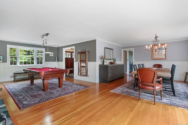 101 Golden Hill St, Trumbull, CT 06611 - playroom with light wood-type flooring, billiards, a chandelier, crown molding, and a wainscoted wall