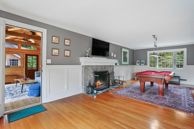 101 Golden Hill St, Trumbull, CT 06611 - playroom with wood finished floors, crown molding, a fireplace, billiards table, and a wainscoted wall