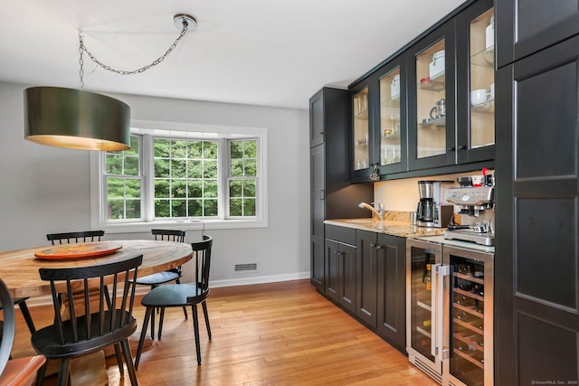 101 Golden Hill St, Trumbull, CT 06611 - indoor wet bar featuring beverage cooler and light wood-type flooring