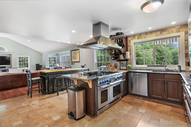 101 Golden Hill St, Trumbull, CT 06611 - kitchen featuring island exhaust hood, stainless steel appliances, a peninsula, open floor plan, and plenty of natural light