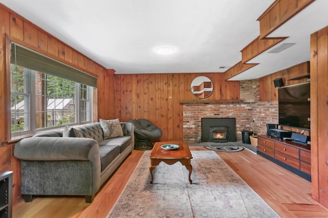 101 Golden Hill St, Trumbull, CT 06611 - living area with light wood-type flooring and wooden walls