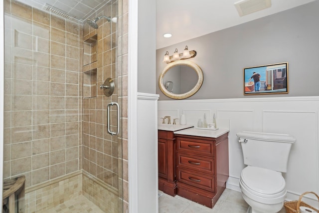 101 Golden Hill St, Trumbull, CT 06611 - bathroom with a shower stall, vanity, a wainscoted wall, a decorative wall, and tile patterned flooring