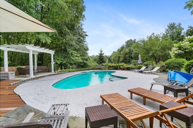101 Golden Hill St, Trumbull, CT 06611 - view of swimming pool featuring a pergola, a patio, view of wooded area, and a deck