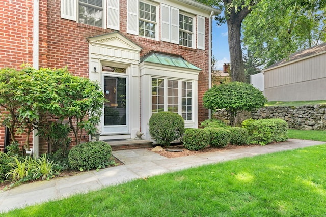 312 Elm St Apt 9, New Canaan, CT 06840 - entrance to property with brick siding, a standing seam roof, and a lawn
