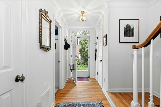 312 Elm St Apt 9, New Canaan, CT 06840 - entryway with light wood-type flooring, stairs, and ornamental molding