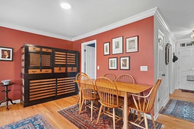 312 Elm St Apt 9, New Canaan, CT 06840 - dining room featuring ornamental molding and wood finished floors