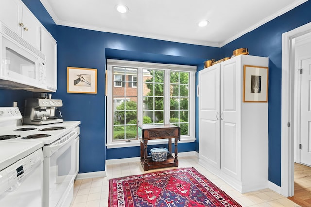 312 Elm St Apt 9, New Canaan, CT 06840 - kitchen featuring white appliances, light countertops, light tile patterned floors, white cabinetry, and crown molding