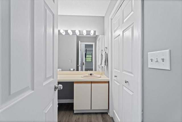 34 Village View Ter Unit 34, Meriden, CT 06451 - bathroom with vanity, wood finished floors, and a closet