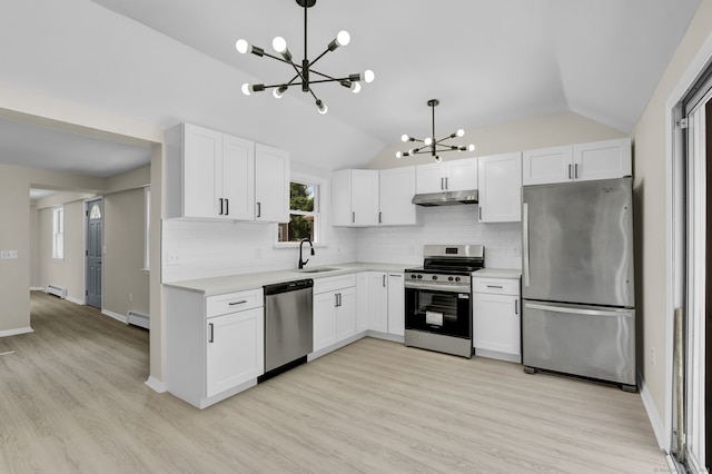 169 Mount Pleasant St, Norwich, CT 06360 - kitchen featuring stainless steel appliances, a chandelier, under cabinet range hood, vaulted ceiling, and light countertops