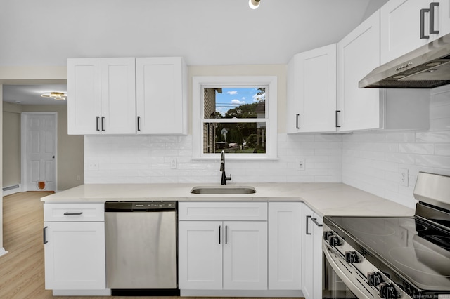 169 Mount Pleasant St, Norwich, CT 06360 - kitchen with appliances with stainless steel finishes, exhaust hood, white cabinetry, and decorative backsplash