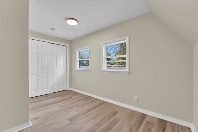 169 Mount Pleasant St, Norwich, CT 06360 - unfurnished bedroom featuring light wood finished floors, a closet, and lofted ceiling