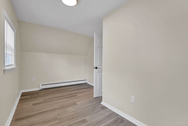 169 Mount Pleasant St, Norwich, CT 06360 - bonus room featuring a baseboard heating unit, light wood-type flooring, and lofted ceiling