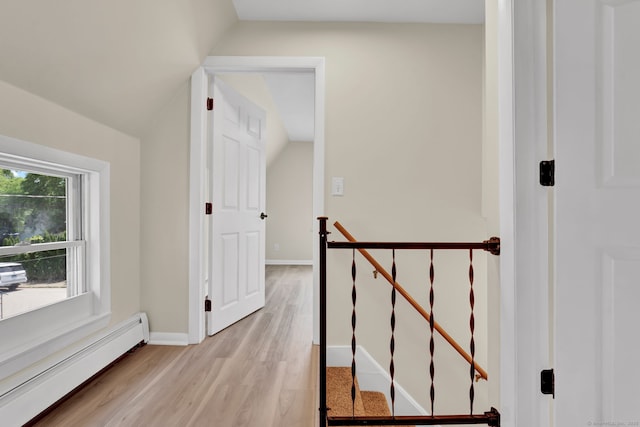 169 Mount Pleasant St, Norwich, CT 06360 - corridor with a baseboard heating unit, an upstairs landing, light wood finished floors, and lofted ceiling