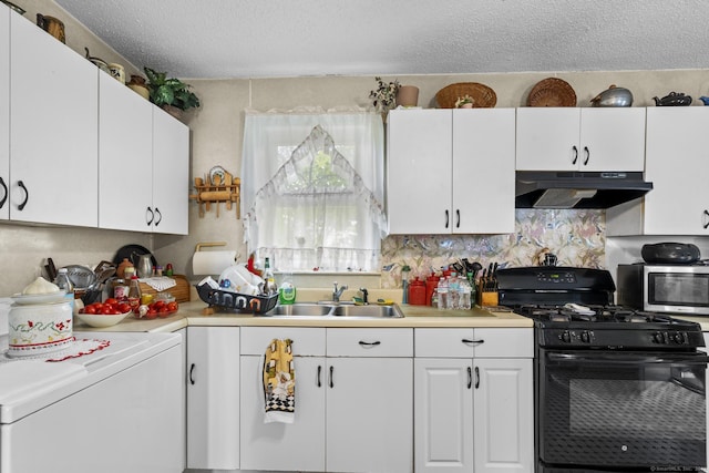 33 Aetna St, Naugatuck, CT 06770 - kitchen with under cabinet range hood, black gas range, washer / clothes dryer, stainless steel microwave, and light countertops