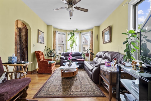 33 Aetna St, Naugatuck, CT 06770 - living area with ceiling fan, arched walkways, and wood finished floors
