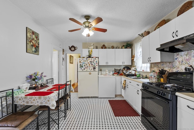 33 Aetna St, Naugatuck, CT 06770 - kitchen featuring freestanding refrigerator, gas stove, under cabinet range hood, a ceiling fan, and white cabinetry
