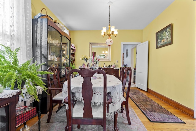 33 Aetna St, Naugatuck, CT 06770 - dining area featuring a chandelier and wood finished floors