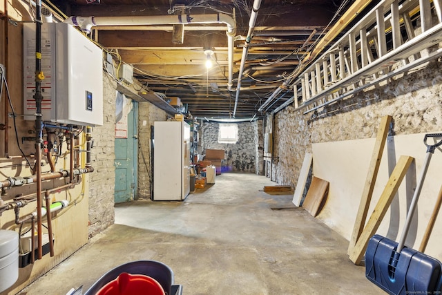 33 Aetna St, Naugatuck, CT 06770 - basement with water heater and freestanding refrigerator