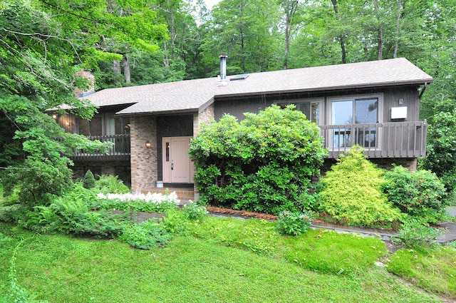172 Bentley Cir, Goshen, CT 06756 - view of front of house with a chimney, a shingled roof, and brick siding