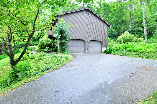 172 Bentley Cir, Goshen, CT 06756 - view of property exterior featuring asphalt driveway and an attached garage