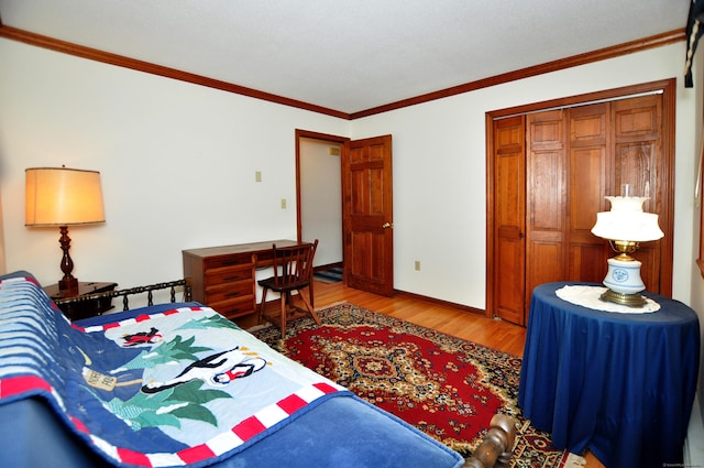 172 Bentley Cir, Goshen, CT 06756 - bedroom with wood finished floors, ornamental molding, and a closet