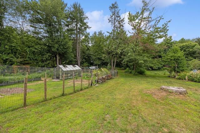 931 Chestnut Hill Rd, Glastonbury, CT 06073 - view of yard featuring a greenhouse, an outdoor structure, and a vegetable garden