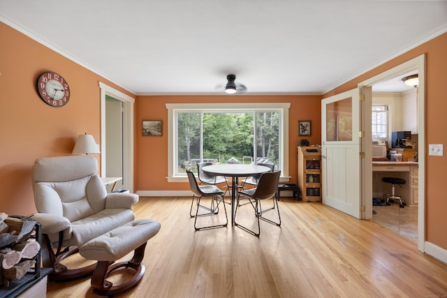 931 Chestnut Hill Rd, Glastonbury, CT 06073 - dining space with a desk, healthy amount of natural light, light wood-style flooring, and ornamental molding