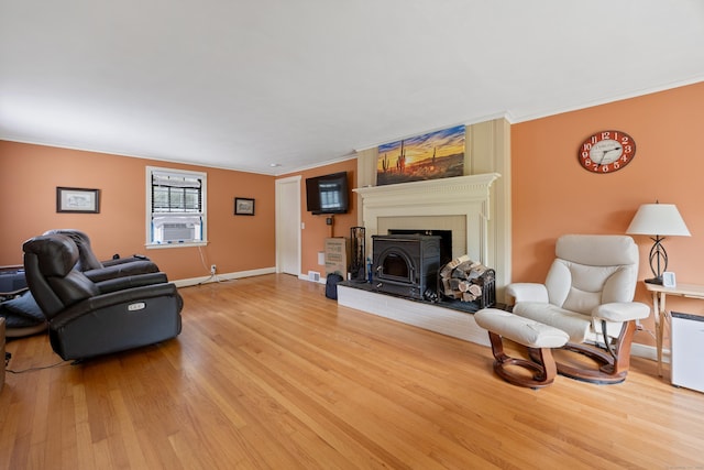 931 Chestnut Hill Rd, Glastonbury, CT 06073 - living area with ornamental molding, light wood-style floors, cooling unit, and a fireplace