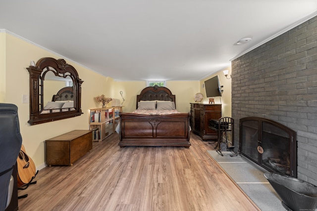 931 Chestnut Hill Rd, Glastonbury, CT 06073 - bedroom with light wood-type flooring and a fireplace