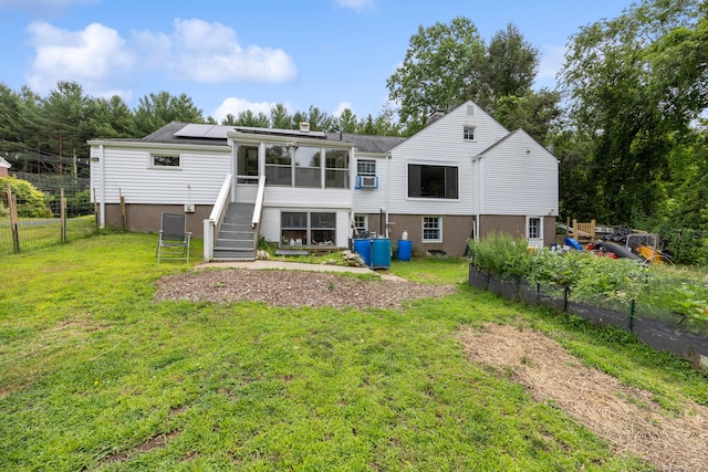 931 Chestnut Hill Rd, Glastonbury, CT 06073 - rear view of house with roof mounted solar panels, stairs, a sunroom, a chimney, and cooling unit
