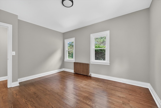 3 Moody Ln, Danbury, CT 06811 - unfurnished room featuring radiator heating unit and dark wood-type flooring