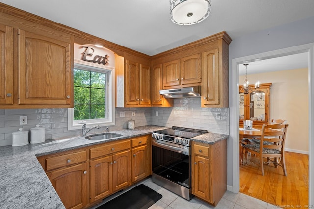 62 Peach Tree Ln, Berlin, CT 06037 - kitchen featuring stainless steel electric stove, under cabinet range hood, brown cabinetry, and light stone countertops