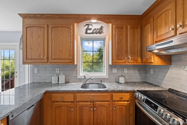 62 Peach Tree Ln, Berlin, CT 06037 - kitchen with under cabinet range hood, appliances with stainless steel finishes, light stone counters, and decorative backsplash