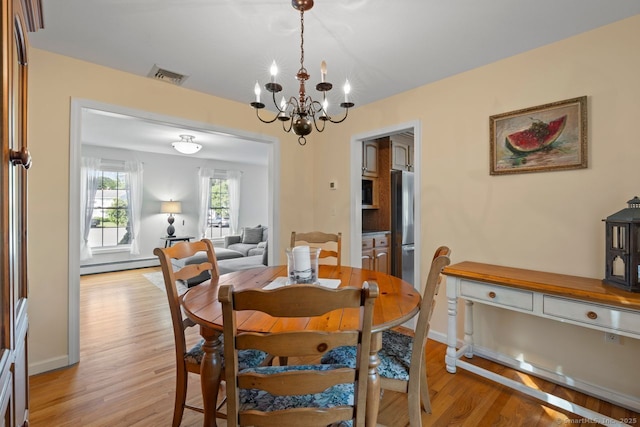 62 Peach Tree Ln, Berlin, CT 06037 - dining area with a chandelier, light wood-type flooring, and baseboard heating