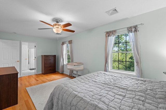 62 Peach Tree Ln, Berlin, CT 06037 - bedroom featuring wood finished floors, a baseboard radiator, and ceiling fan