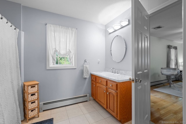 62 Peach Tree Ln, Berlin, CT 06037 - full bath with a baseboard radiator, vanity, and tile patterned floors