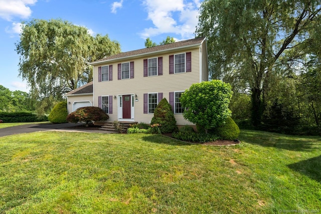 62 Peach Tree Ln, Berlin, CT 06037 - colonial inspired home with an attached garage, asphalt driveway, and a front lawn