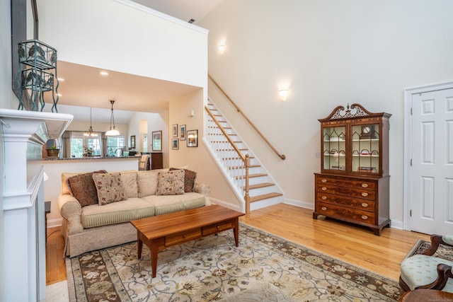 802 Dzen Way Unit 802, South Windsor, CT 06074 - living area with wood finished floors, stairway, and a towering ceiling