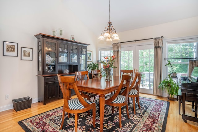 802 Dzen Way Unit 802, South Windsor, CT 06074 - dining space featuring a chandelier, light wood-style flooring, high vaulted ceiling, and french doors