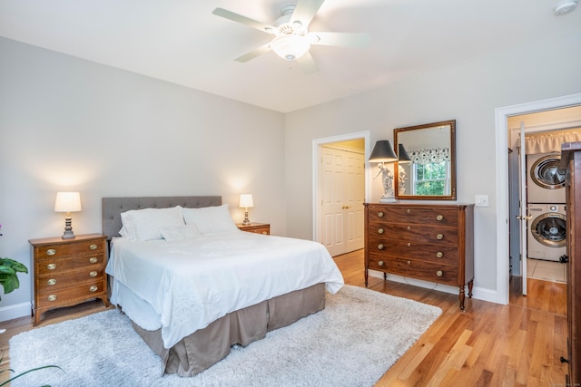 802 Dzen Way Unit 802, South Windsor, CT 06074 - bedroom with estacked washer and dryer, light wood-type flooring, a ceiling fan, and a closet