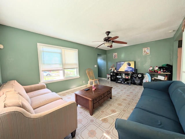 715 Burnsford Ave, Bridgeport, CT 06606 - living area featuring a ceiling fan and baseboards