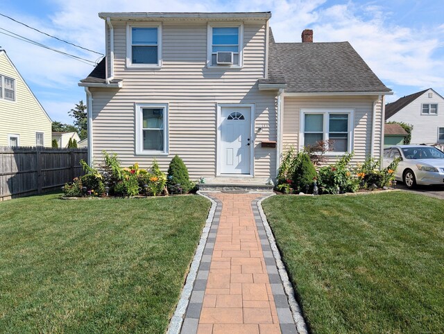715 Burnsford Ave, Bridgeport, CT 06606 - traditional-style house featuring a chimney, a shingled roof, and cooling unit