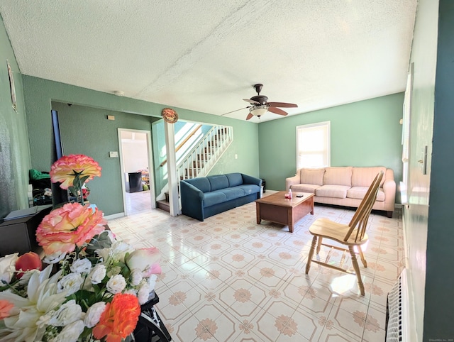 715 Burnsford Ave, Bridgeport, CT 06606 - living room featuring stairs, ceiling fan, a textured ceiling, and tile patterned floors