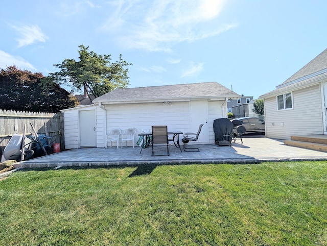 715 Burnsford Ave, Bridgeport, CT 06606 - back of house with a patio, an outbuilding, and roof with shingles